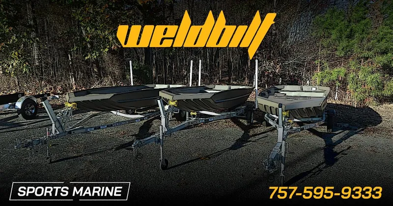 Slide: The Image of Three WeldBilt 1652V boats on trailers at Sports Marine dealership, 2025 model. - 10