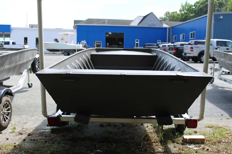 Slide: The Image of 2025 WeldBilt 1652V boat on trailer in outdoor dealership lot. - 6