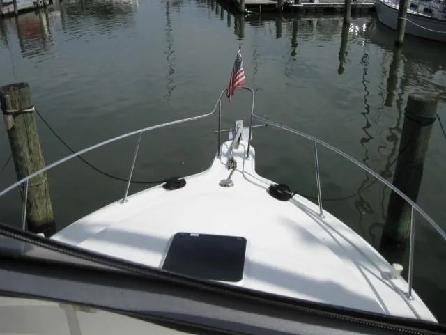 Slide: The Image of Bow view of 1996 Carver 320 Voyager docked at marina. - 5