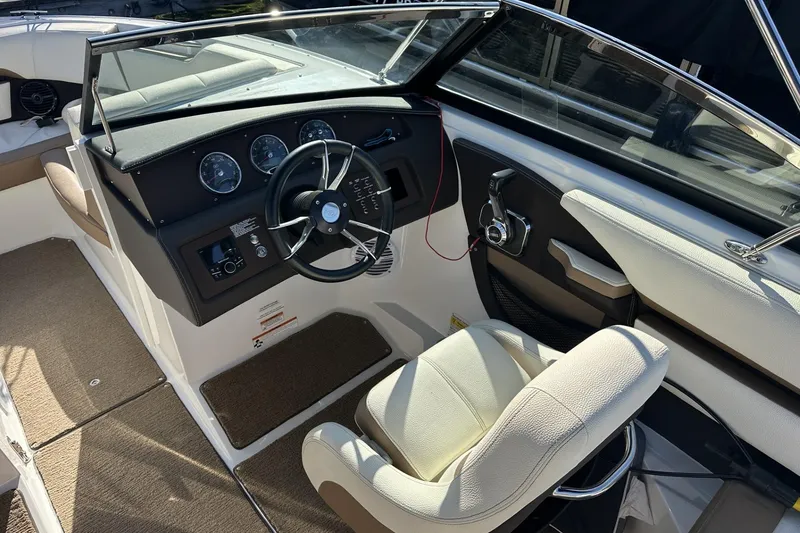 Slide: The Image of 2018 Cobalt CS23 boat interior with steering wheel and dashboard controls. - 11