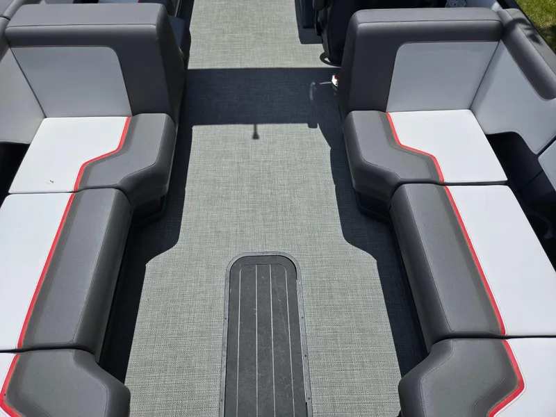 Slide: The Image of 2024 Manitou Cruise boat interior with gray and red seating, modern design. - 14