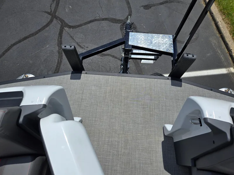 Slide: The Image of 2024 Manitou Cruise boat deck with trailer hitch, viewed from above. - 19