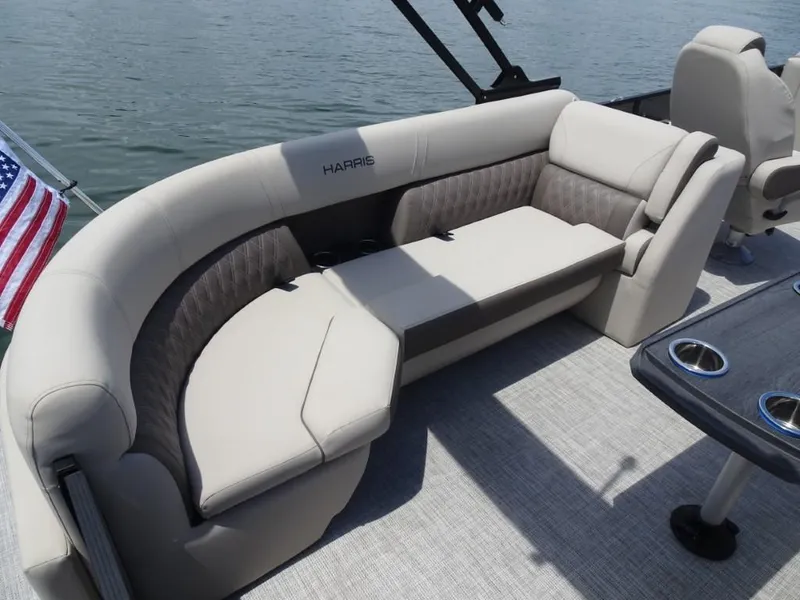 Slide: The Image of Luxurious seating on 2023 Harris Sunliner 250 pontoon boat with American flag. - 10