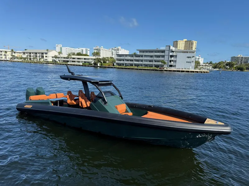 Slide: The Image of 2025 Skipper-BSK 38 boat on water, modern design, cityscape background, clear blue sky. - 8