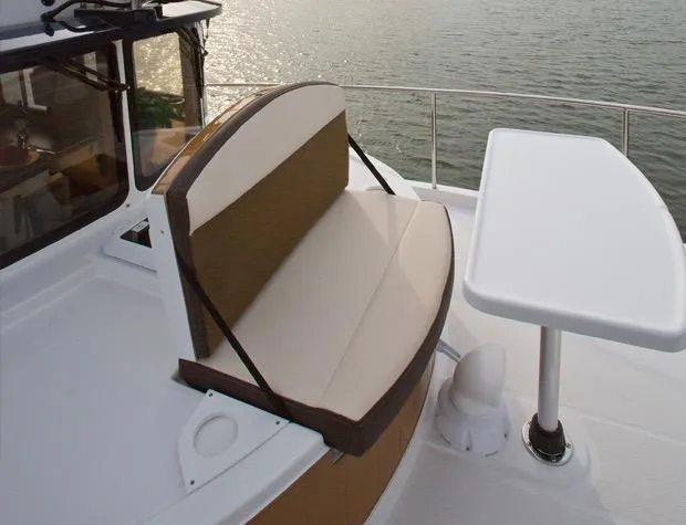 Slide: The Image of 2014 Ranger Tugs R-31CB boat seating area with table, overlooking water. - 12