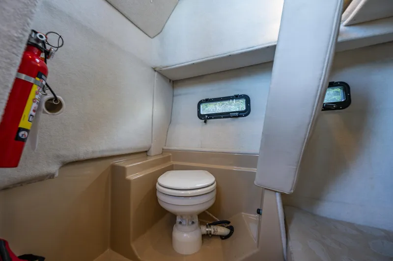 Slide: The Image of 2014 Ranger Tugs R-31CB boat interior with toilet and fire extinguisher. - 33