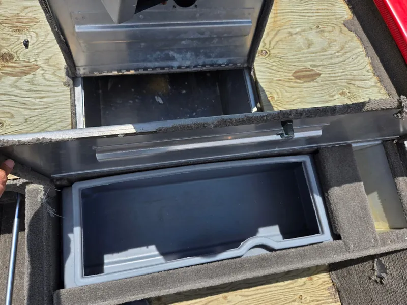 Slide: The Image of Open storage compartment in a 2004 Tracker Pro Team 175 boat. - 14