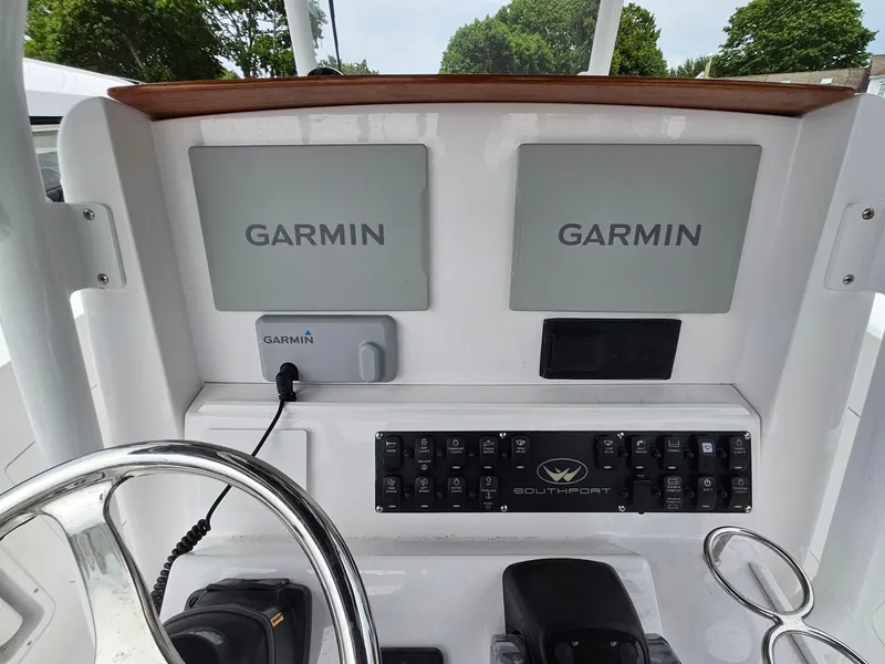 Slide: The Image of Dashboard of 2022 Southport 27 FE boat with Garmin navigation displays. - 13