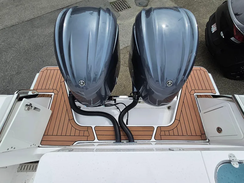 Slide: The Image of 2022 Southport 27 FE boat with dual outboard engines and teak deck. - 4