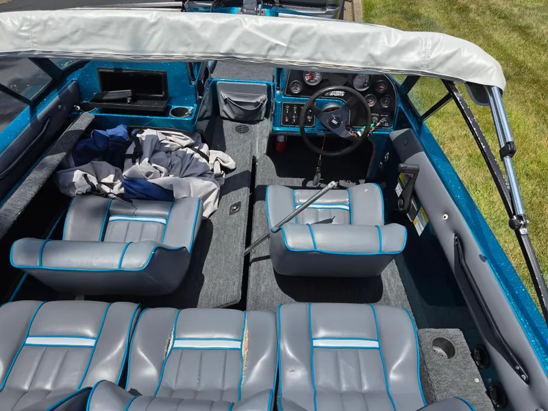 Slide: The Image of 1994 Hydra-Sports 175 FS boat interior with gray seats and steering wheel. - 11