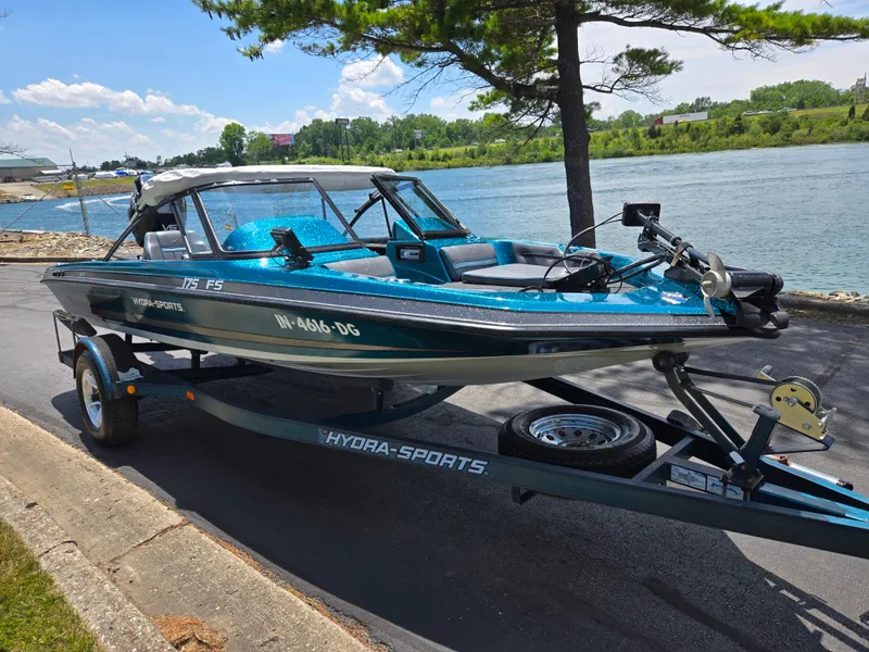 Slide: The Image of 1994 Hydra-Sports 175 FS boat on trailer by a scenic riverside. - 9