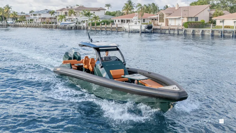 Slide: The Image of Skipper-BSK 38 yacht cruising near waterfront homes, 2025 model. - 6