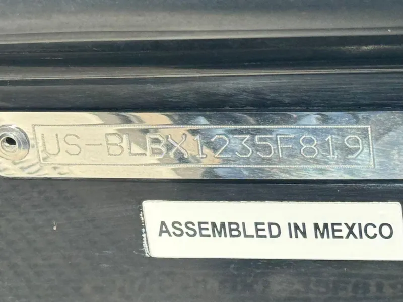 Slide: The Image of 2019 Bayliner Element E16 hull identification number and "Assembled in Mexico" label. - 19