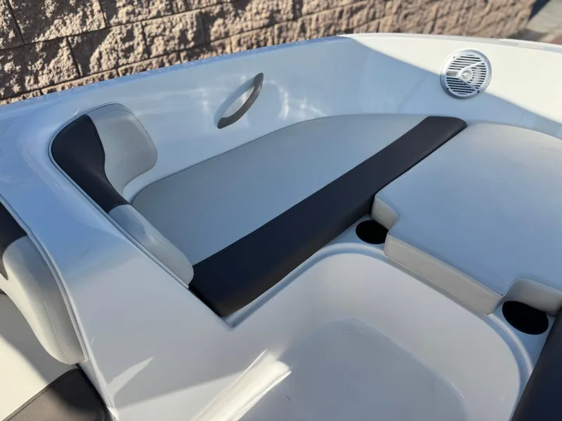 Slide: The Image of 2019 Bayliner Element E16 boat interior with cushioned seating and speaker. - 8