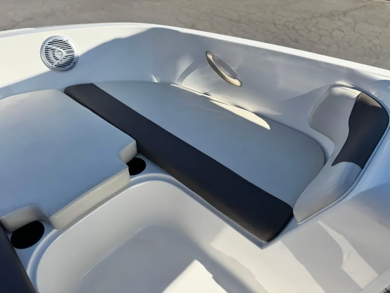 Slide: The Image of 2019 Bayliner Element E16 boat interior with cushioned seating and speaker. - 9