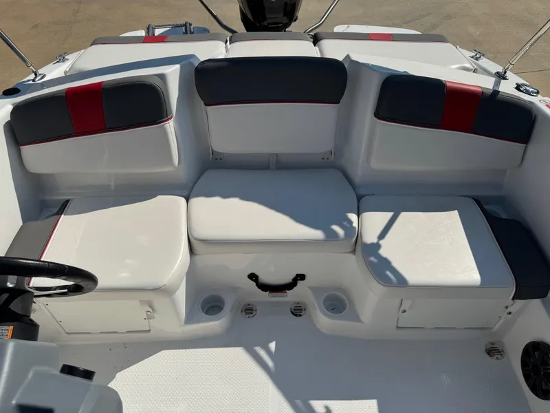 Slide: The Image of 2022 Tahoe T16 boat interior with white and red cushioned seating. - 4