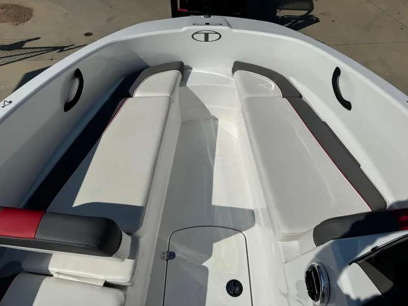 Slide: The Image of 2022 Tahoe T16 boat interior with white and gray seating, outdoor setting. - 6