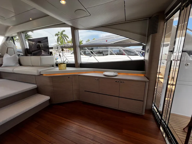 Slide: The Image of Luxurious interior of 2022 Princess F55 yacht with modern furnishings and large windows. - 10