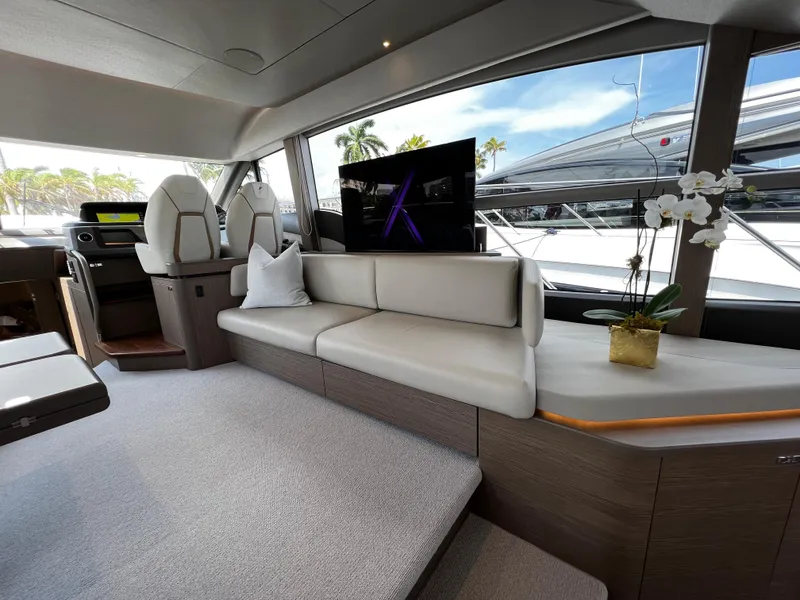 Slide: The Image of Luxurious interior of 2022 Princess F55 yacht with modern seating and elegant decor. - 11
