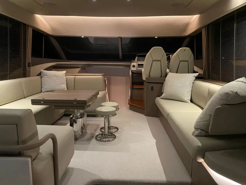 Slide: The Image of Luxurious interior of 2022 Princess F55 yacht with modern seating and elegant decor. - 13