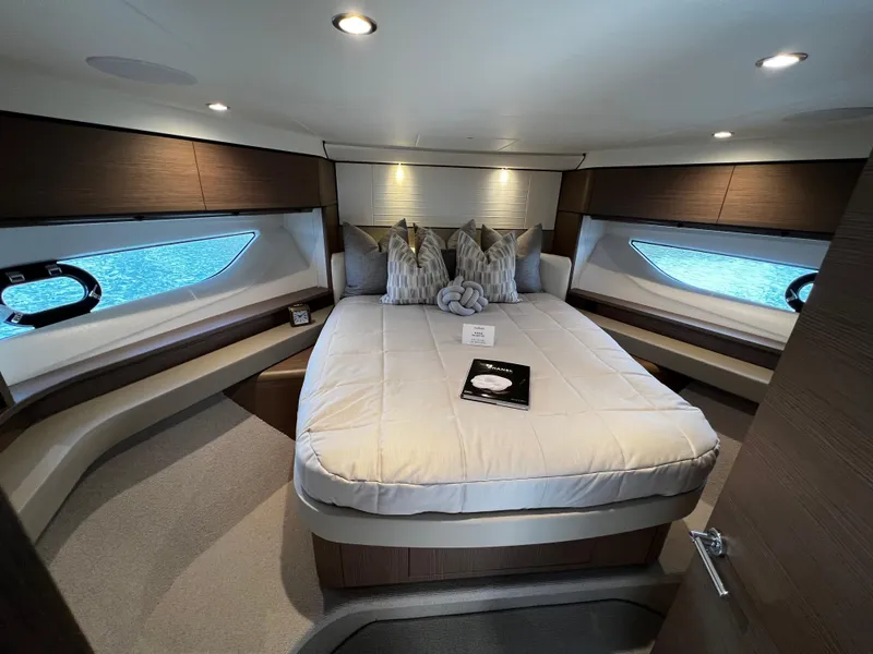 Slide: The Image of Luxurious 2022 Princess F55 yacht bedroom with elegant decor and large windows. - 16