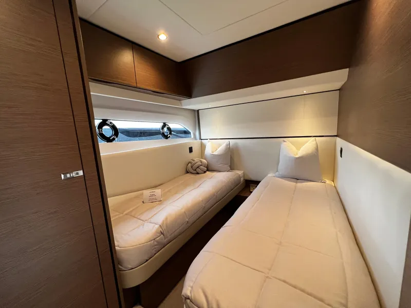 Slide: The Image of Luxurious cabin interior of 2022 Princess F55 yacht with twin beds and modern design. - 17