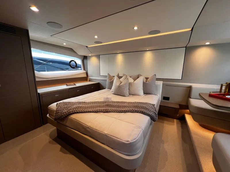 Slide: The Image of Luxurious bedroom interior of 2022 Princess F55 yacht with modern design and cozy bedding. - 18