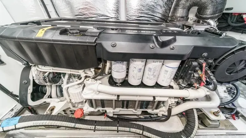 Slide: The Image of Engine of a 2022 Princess F55 yacht, showcasing intricate mechanical components. - 27