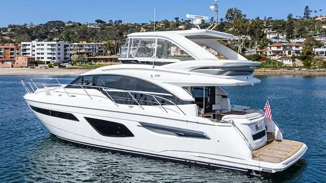 Slide: The Image of Luxury 2022 Princess F55 yacht cruising near scenic coastline. - 32