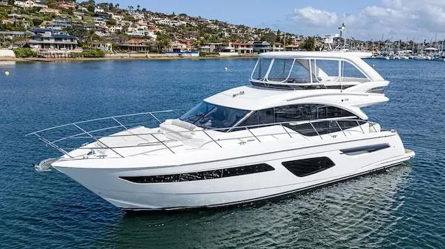 Slide: The Image of Luxury 2022 Princess F55 yacht cruising in scenic coastal waters. - 34