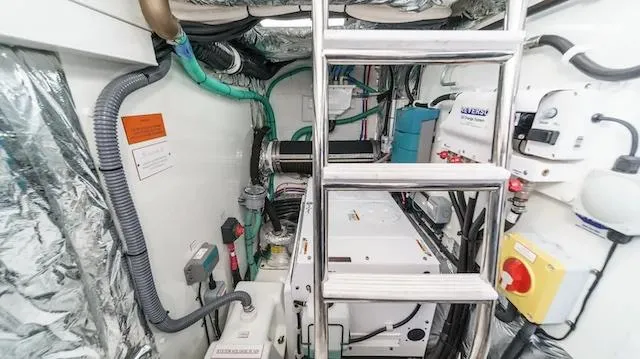 Slide: The Image of Engine room of 2022 Princess F55 yacht with visible machinery and ladder. - 35