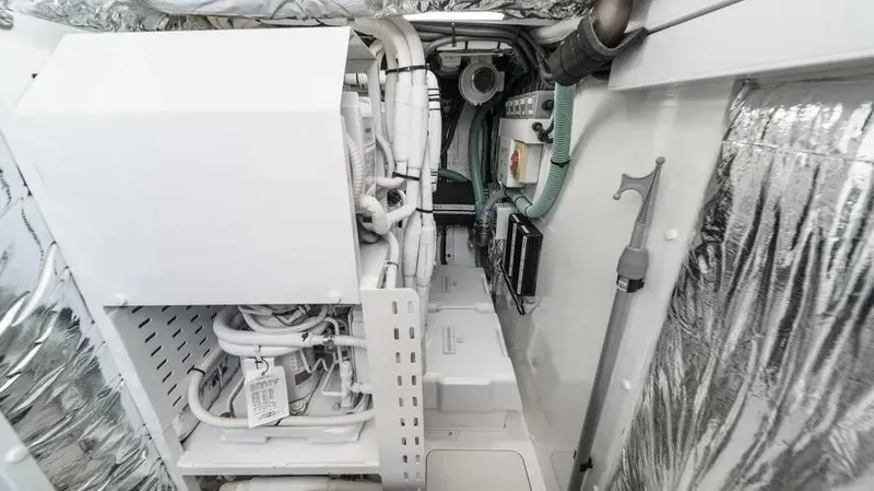 Slide: The Image of Engine room of 2022 Princess F55 yacht with insulated walls and complex piping system. - 37