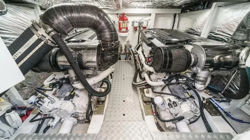 Slide: The Image of Engine room of 2022 Princess F55 yacht, featuring dual engines and advanced equipment. - 38