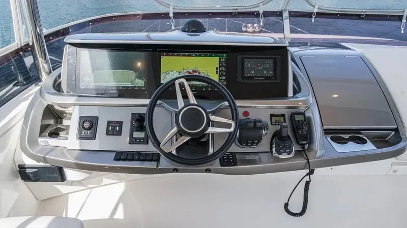 Slide: The Image of Helm of 2022 Princess F55 yacht with advanced navigation controls and displays. - 47