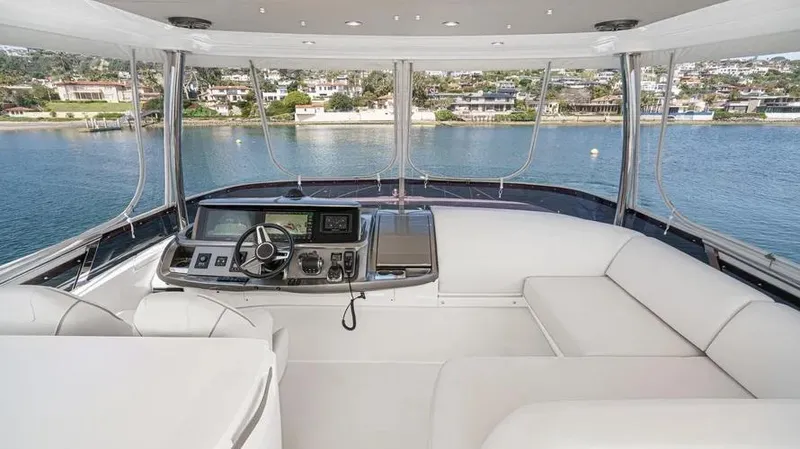 Slide: The Image of Luxurious 2022 Princess F55 yacht interior with modern helm and panoramic water views. - 49