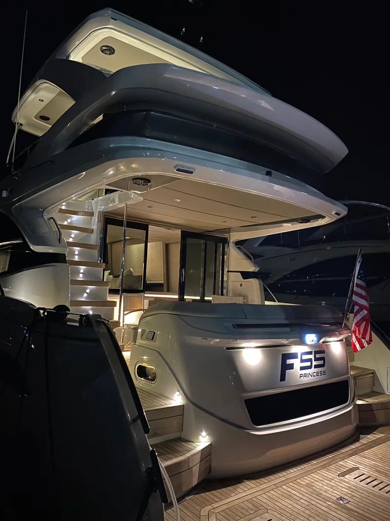 Slide: The Image of Luxurious 2022 Princess F55 yacht illuminated at night, showcasing elegant design and modern features. - 7