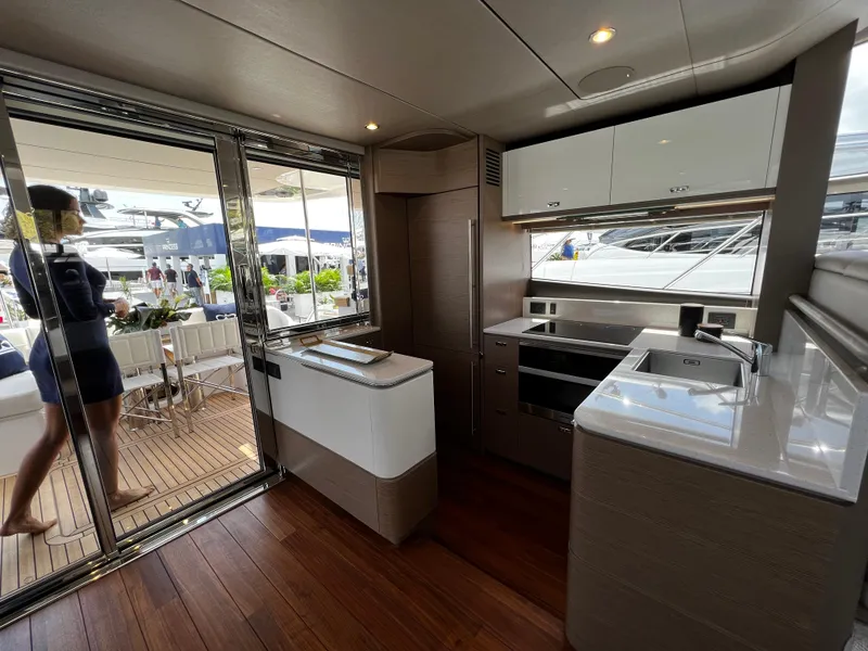 Slide: The Image of Luxurious interior of 2022 Princess F55 yacht with modern kitchen and outdoor seating area. - 8