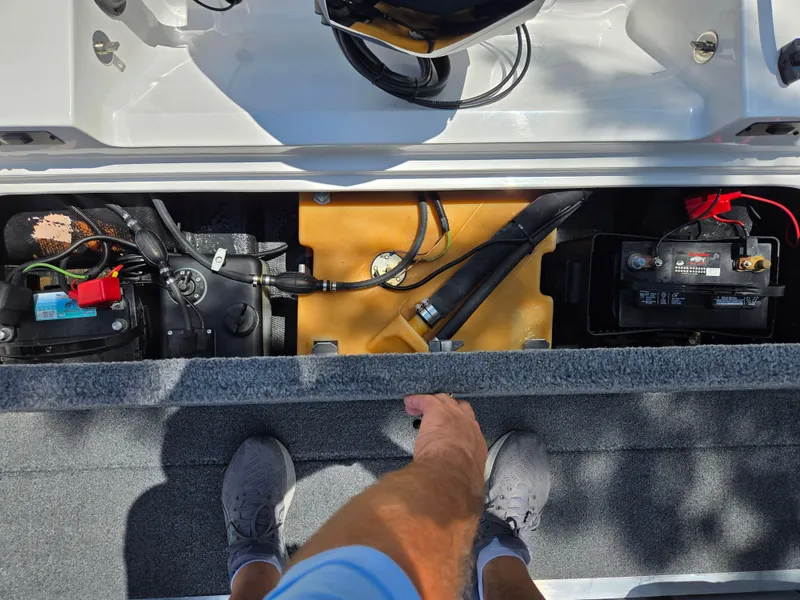 Slide: The Image of Interior view of a 1996 Javelin 360 FS boat showing battery and wiring components. - 23