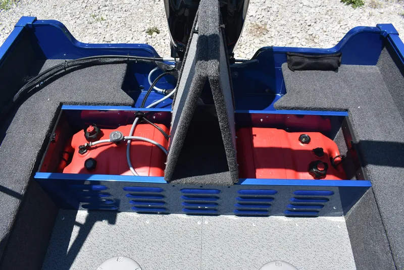 Slide: The Image of 2022 Lund 1650 Angler Sport boat interior showing fuel compartments and storage. - 13