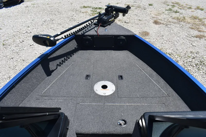 Slide: The Image of 2022 Lund 1650 Angler Sport boat deck with trolling motor, gray carpet, and storage compartments. - 7