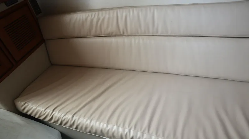 Slide: The Image of Cream leather seating inside 2012 Cruisers Yachts 350 Express. - 17