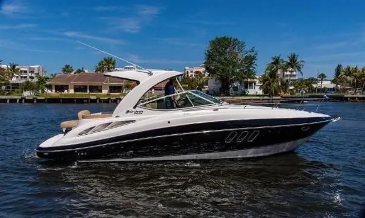 Slide: The Image of 2012 Cruisers Yachts 350 Express on water, sleek design, sunny day, waterfront background. - 3