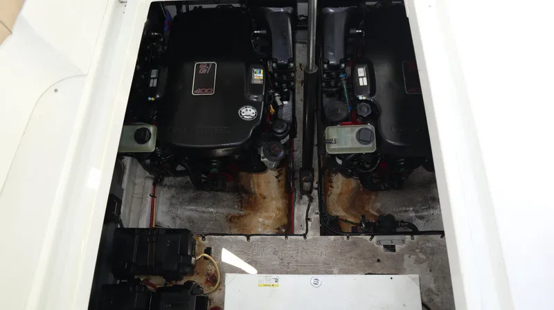 Slide: The Image of Engine compartment of 2012 Cruisers Yachts 350 Express, featuring dual inboard engines. - 31