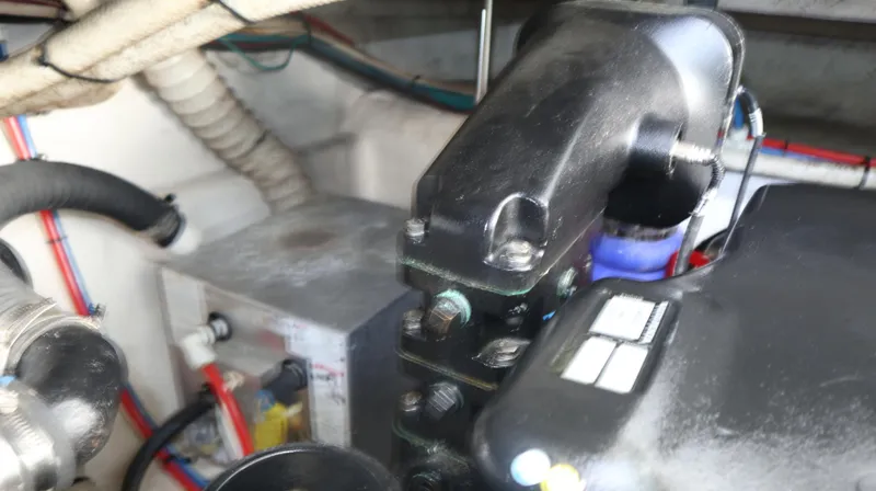 Slide: The Image of Engine compartment of 2012 Cruisers Yachts 350 Express with visible components and wiring. - 33