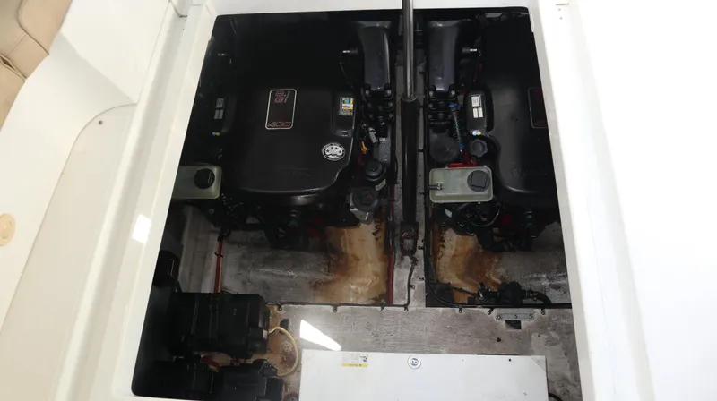 Slide: The Image of Engine compartment of 2012 Cruisers Yachts 350 Express, featuring dual engines. - 35