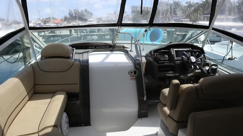 Slide: The Image of Interior of 2012 Cruisers Yachts 350 Express with helm and seating area. - 8