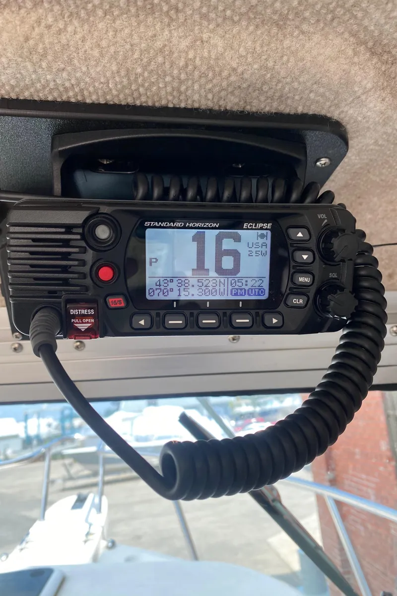 Slide: The Image of Marine radio in a 2009 Parker 2120 Sport Cabin boat, displaying channel 16. - 12