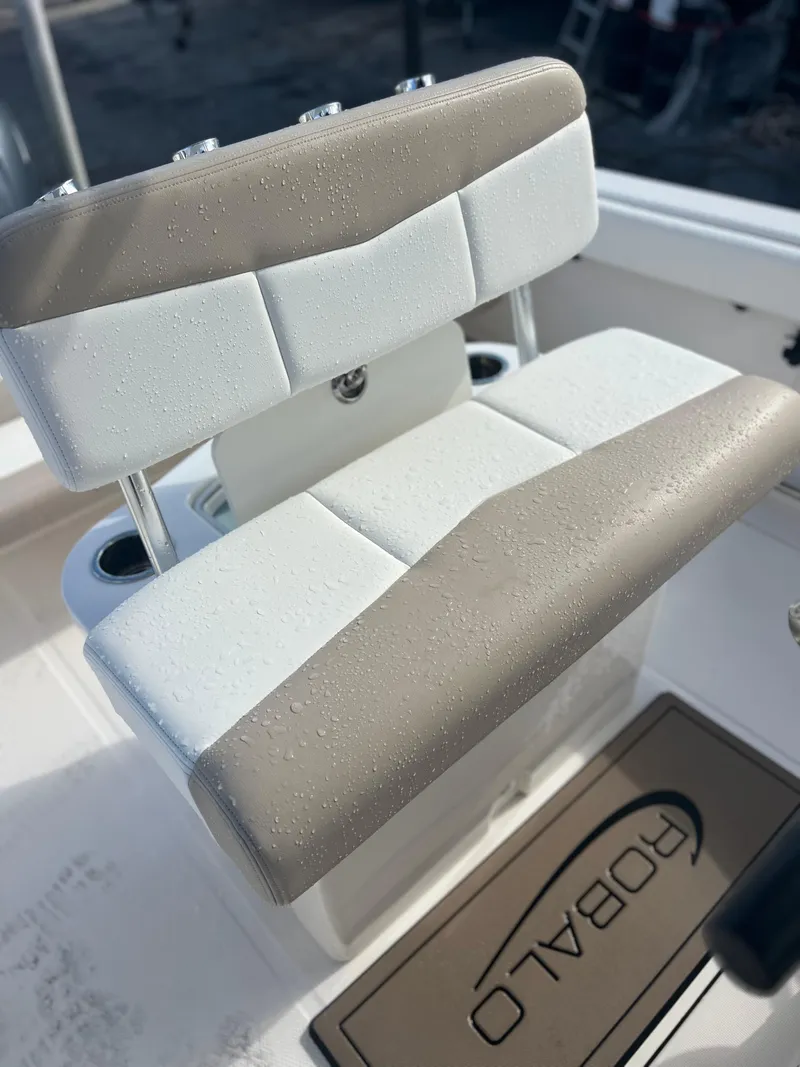 Slide: The Image of 2022 Robalo R222 Center Console boat seat with water droplets. - 14