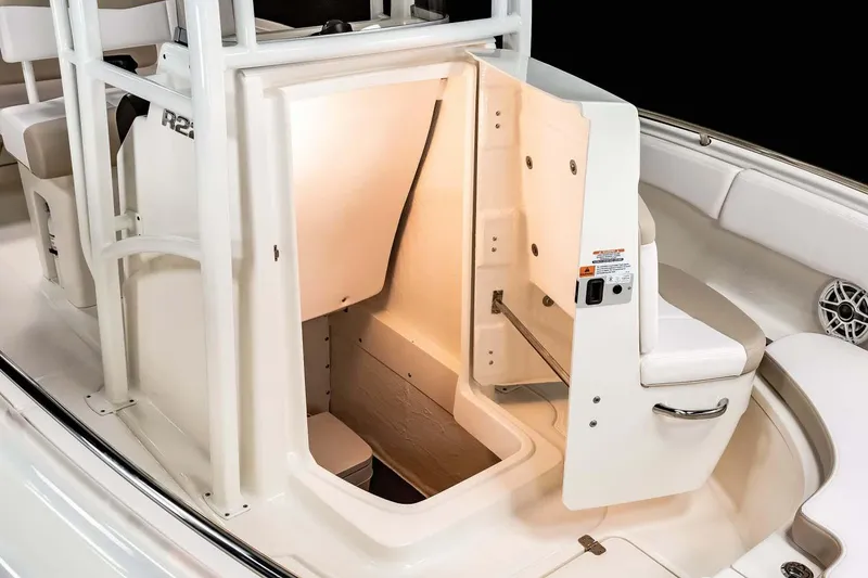 Slide: The Image of Manufacturer Provided Image: 2022 Robalo R222 Center Console boat with open storage compartment. - 15