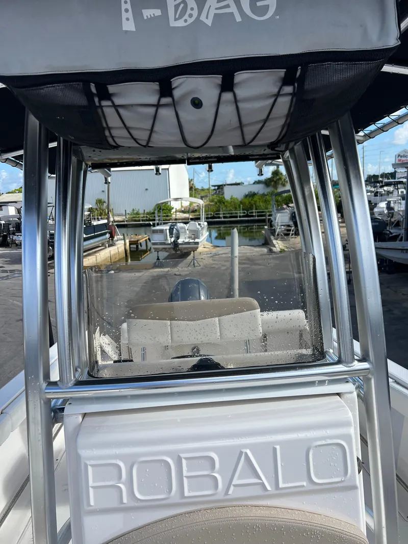 Slide: The Image of 2022 Robalo R222 Center Console boat with T-top and wet windshield. - 8